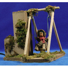 Niño con columpio movimiento 12 cm barro pintado